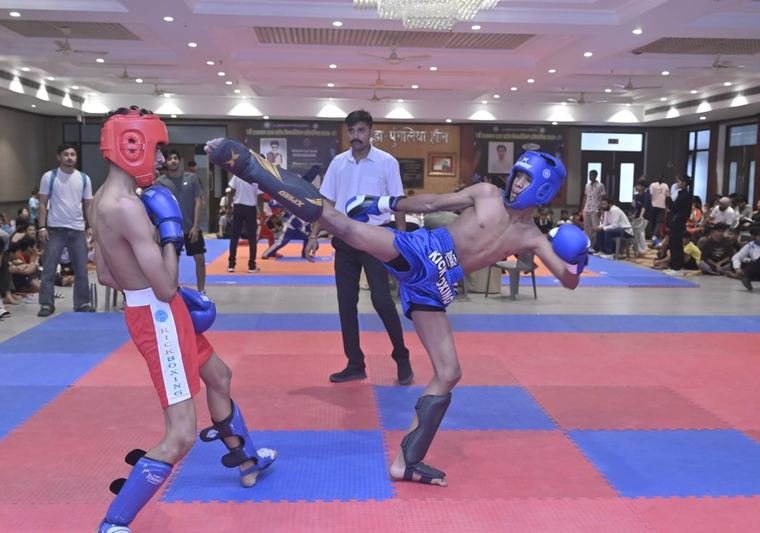 Athlete landing a high kick during a match